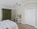 Well-lit bedroom with large closet and wooden furniture at 1644 Shell Point Ave, The Villages, FL 32162