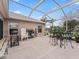 Relaxing screened patio with seating area and plants at 1644 Shell Point Ave, The Villages, FL 32162