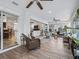 Spacious sunroom showcasing wicker furniture and views into the home's interior at 1644 Shell Point Ave, The Villages, FL 32162