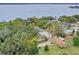 Aerial view of waterfront property with large lot and mature trees at 1660 1St St, Clermont, FL 34711