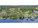 Aerial view of the property and surrounding neighborhood, near the waterfront at 1660 1St St, Clermont, FL 34711