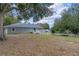 Spacious backyard with mature trees and a fenced perimeter at 1660 1St St, Clermont, FL 34711