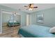 Bedroom with mirrored closet and ceiling fan at 1660 1St St, Clermont, FL 34711