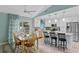 Bright kitchen with an island, white cabinets, and view into dining area at 1660 1St St, Clermont, FL 34711