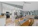 Updated kitchen with island, white cabinets, and adjacent dining area at 1660 1St St, Clermont, FL 34711