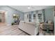 Living room with light walls, a neutral couch, and a view of the backyard at 1660 1St St, Clermont, FL 34711