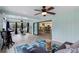Bright sunroom with water views, featuring comfortable seating and a workspace at 1660 1St St, Clermont, FL 34711