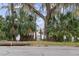 Secluded waterfront access with a wooden gate at 1660 1St St, Clermont, FL 34711