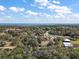 Aerial view showcasing the property and surrounding waterfront at 19211 County Road 455, Clermont, FL 34715