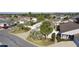 Aerial view of house and neighborhood, showcasing landscaping at 1945 Fiddlewood Pl, The Villages, FL 32162