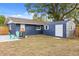 Backyard view of home with shed and patio at 2001 Sanford Ave, Sanford, FL 32771