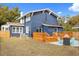 Large backyard with deck, shed, and fire pit area at 2001 Sanford Ave, Sanford, FL 32771