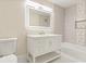 Updated bathroom with a white vanity and stylish tile at 2001 Sanford Ave, Sanford, FL 32771