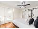 Large bedroom with hardwood floors and white shutters at 2001 Sanford Ave, Sanford, FL 32771