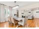 Bright dining room with hardwood floors and a large farmhouse table at 2001 Sanford Ave, Sanford, FL 32771