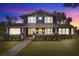 Charming two-story home with a renovated front porch and landscaped yard at 2001 Sanford Ave, Sanford, FL 32771