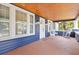 Relaxing front porch with rocking chairs, wood ceiling, and a view of the yard at 2001 Sanford Ave, Sanford, FL 32771