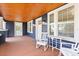 Spacious front porch with rocking chairs and a view of the street at 2001 Sanford Ave, Sanford, FL 32771