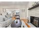 Open living room with a fireplace and hardwood floors at 2001 Sanford Ave, Sanford, FL 32771