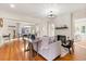 Bright living room with fireplace, hardwood floors, and large windows at 2001 Sanford Ave, Sanford, FL 32771