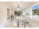 Sunlit office with glass desk and large windows at 2001 Sanford Ave, Sanford, FL 32771