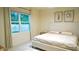 Inviting bedroom featuring a large window, soft natural light, and views of the home's landscaping at 2295 Delhi Pl, Sanford, FL 32771