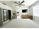 Spacious main bedroom with ceiling fan, ensuite bath, tv, and a walk-in closet at 2295 Delhi Pl, Sanford, FL 32771