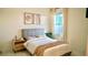 Cozy bedroom with a queen-size bed and neutral decor at 2295 Delhi Pl, Sanford, FL 32771