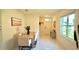 Light and airy dining area with a wood table and chairs at 2295 Delhi Pl, Sanford, FL 32771