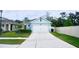 Cute blue house with a two-car garage and a landscaped front yard at 2295 Delhi Pl, Sanford, FL 32771