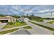 New single-story home features a two-car garage, an expansive driveway and a well-manicured front lawn at 2295 Delhi Pl, Sanford, FL 32771