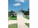 Well-maintained single-Gathering home with a large driveway and a neatly landscaped front yard at 2295 Delhi Pl, Sanford, FL 32771