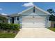 Charming single-Gathering home features a two-car garage and well-manicured landscaping at 2295 Delhi Pl, Sanford, FL 32771