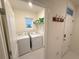 Functional laundry room with a washer, dryer, and exterior door for added convenience at 2295 Delhi Pl, Sanford, FL 32771