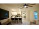 Open concept living space features stylish bar seating, modern lighting, and sleek tile floors at 2295 Delhi Pl, Sanford, FL 32771