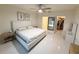 Bright main bedroom with ample natural light, neutral decor, and a walk-in closet at 2295 Delhi Pl, Sanford, FL 32771