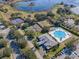 Aerial view of community with pool, tennis, and pickleball courts at 25141 Clifford Hl, Leesburg, FL 34748