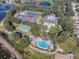 Aerial view showing clubhouse, pool, and tennis courts at 25141 Clifford Hl, Leesburg, FL 34748