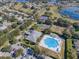 Aerial view of community pool, tennis courts and clubhouse at 25141 Clifford Hl, Leesburg, FL 34748