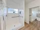 Walk-in shower with grab bars and modern fixtures at 25141 Clifford Hl, Leesburg, FL 34748