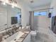 Updated bathroom with tub shower combo and granite vanity at 25141 Clifford Hl, Leesburg, FL 34748