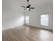 Large bedroom with hardwood floors and two windows at 25141 Clifford Hl, Leesburg, FL 34748