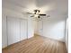 Bedroom with double door closet and ceiling fan at 25141 Clifford Hl, Leesburg, FL 34748