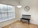 Bright dining area with a large window and stylish bench at 25141 Clifford Hl, Leesburg, FL 34748