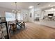 Elegant dining room features a round table and chairs with hardwood floors at 25141 Clifford Hl, Leesburg, FL 34748