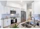Modern kitchen with stainless steel appliances and granite countertops at 25141 Clifford Hl, Leesburg, FL 34748