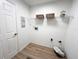 Bright laundry room with shelving and vinyl flooring at 25141 Clifford Hl, Leesburg, FL 34748