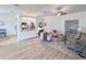 Bright living room features an open floor plan, hardwood floors, and a cozy seating area at 25141 Clifford Hl, Leesburg, FL 34748