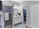 Bathroom with walk-in shower, vanity, and access to a large closet at 26633 Otter Creek Ln, Leesburg, FL 34748