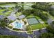 Aerial view showing community pool, tennis courts, and park at 27504 Stoney Brook Dr, Leesburg, FL 34748